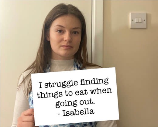 Sign reading, 'I struggle finding things to eat when going out.'