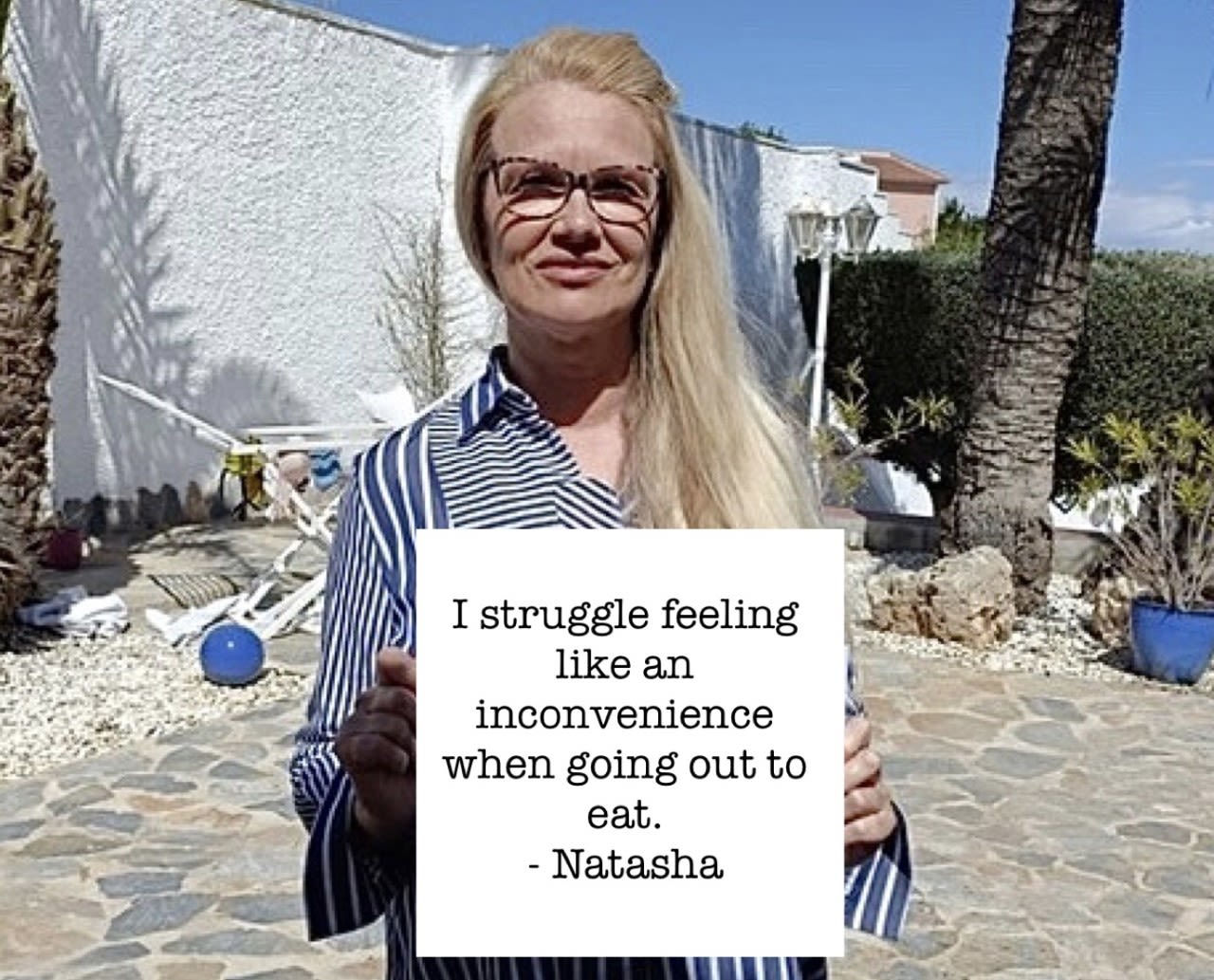 Sign reading, 'I struggle feeling like an inconvenience when going out to eat.'
